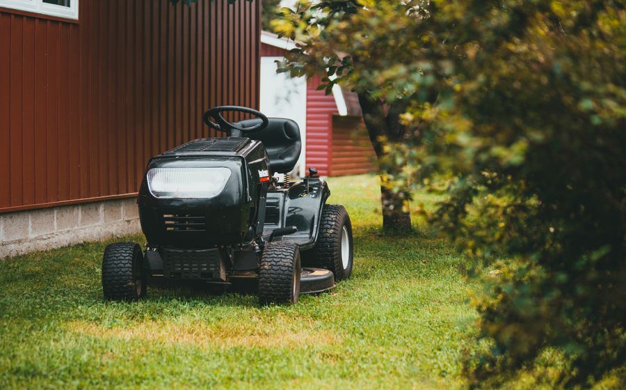 Ride-on lawn mower on a maintained lawn